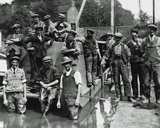 Canal workers Dark Lane, Hatton Locks c1932. James Lewes (Centre), Harold Gee (Centre left)