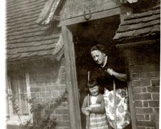 img20211208_0127 Hilda with granddaughter Jane at the back door of Lynton Farm , May 1958