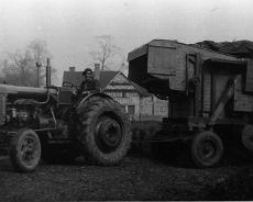 S1504 Cecil Tolley on Fordson Major diesel tractor with thrashing drum at Ivy House Farm - late 1940s